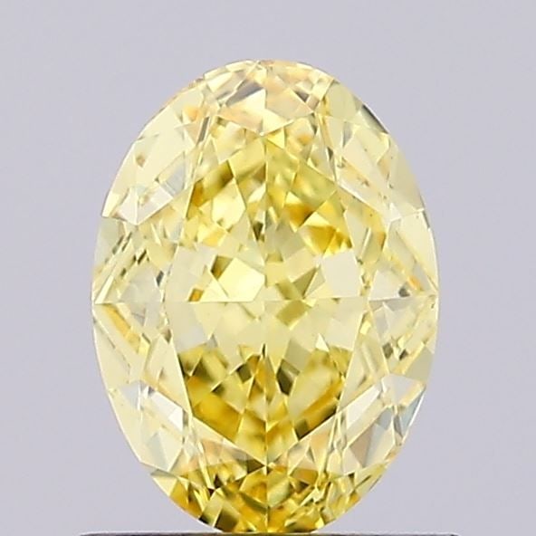 IGI Oval 1.19ct Fancy Vivid Yellow VVS2 Loose Lab Diamond: IGI Oval 1.19ct Fancy Vivid Yellow VVS2 Loose Lab Diamond Experience the brilliance of nature's own sunshine with this stunning 1.19ct Fancy Vivid Yellow VVS2 lab-grown diamond, certified by the Inter
