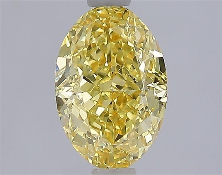 IGI Oval 1.71ct Fancy Vivid Yellow VVS2 Loose Lab Diamond: IGI Oval 1.71ct Fancy Vivid Yellow VVS2 Loose Lab Diamond Experience the brilliance of nature in a lab-grown diamond, certified by IGI as Fancy Vivid Yellow with exceptional clarity and cut. This