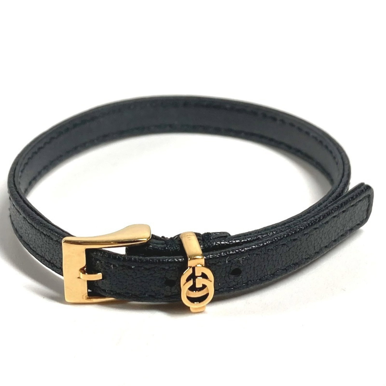 Gucci Leather Charm Bracelet: Gucci Leather Charm Bracelet Elevate your style with the iconic Gucci Leather Charm Bracelet, boasting sleek black leather and a timeless design that exudes luxury. Measuring 17.5-19cm in length, this