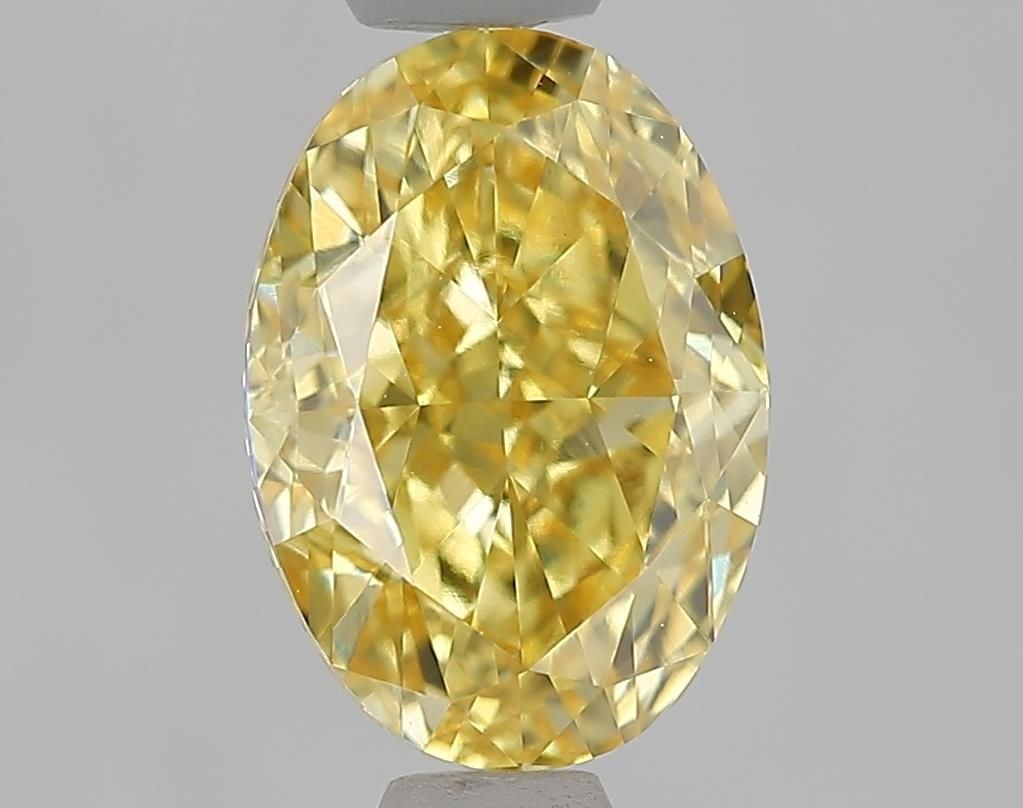 IGI Oval 1.56ct Fancy Intense Yellow VVS2 Loose Lab Diamond: IGI Oval 1.56ct Fancy Intense Yellow VVS2 Loose Lab Diamond Experience the vibrant beauty of nature in this stunning 1.56ct Fancy Intense Yellow VVS2 lab-grown diamond, certified by the International