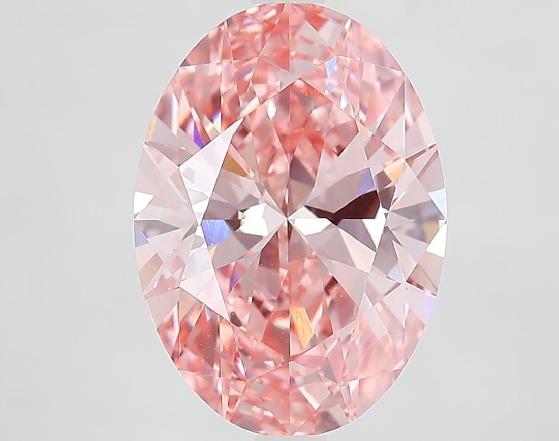 IGI Oval 4.51ct Fancy Vivid Pink VVS2 Diamond: IGI Oval 4.51ct Fancy Vivid Pink VVS2 Diamond Experience the rare beauty of a Fancy Vivid Pink diamond, one of the most coveted colors in nature. This exquisite 4.51ct lab-grown gem boasts exceptional