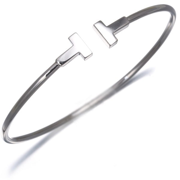 Gold Tiffany&Co. Bracelet Tiffany T Wire Narrow Bangle 18K 750 White: Gold Tiffany&Co. Bracelet Tiffany T Wire Narrow Bangle 18K 750 White Elevate your style with this exquisite 18k white gold Tiffany & Co. bangle, crafted from the iconic TiffanT wire design that has be