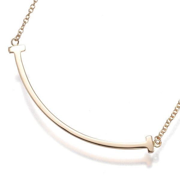 Tiffany & Co. 18k Rose Gold Tiffany T Necklace: Tiffany & Co. 18k Rose Gold Tiffany T Necklace Elevate your style with the iconic Tiffany T necklace, crafted from 18k rose gold and boasting the timeless elegance of Tiffany & Co. This beautiful pend