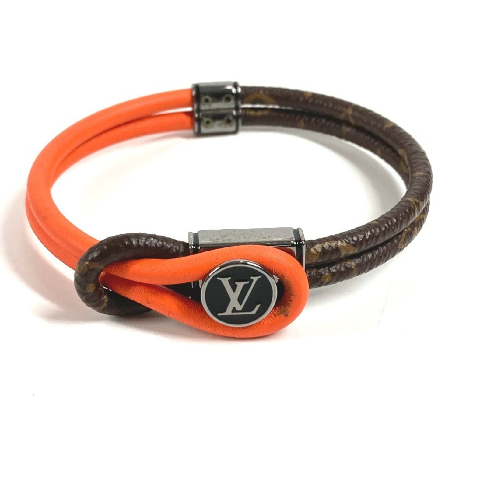 Louis Vuitton Monogram Bangle: Louis Vuitton Monogram Bangle A timeless piece of luxury, the Louis Vuitton Monogram Bangle boasts the iconic signature pattern in rich brown and vibrant orange hues. This stylish accessory is crafted