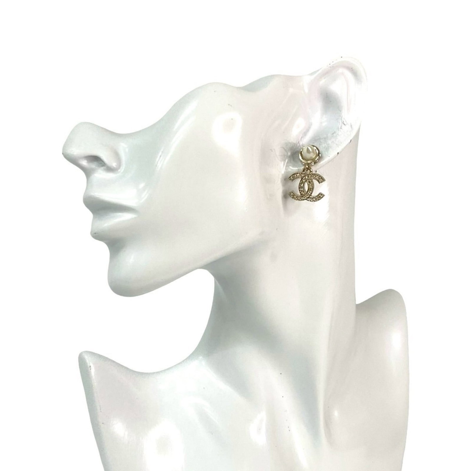 Rhinestone - Chanel Stud Earrings Gold Plating: Rhinestone - Chanel Stud Earrings Gold Plating Add a touch of luxury to your everyday look with these stunning Chanel stud earrings, featuring intricate gold plating and sparkling rhinestones that cat