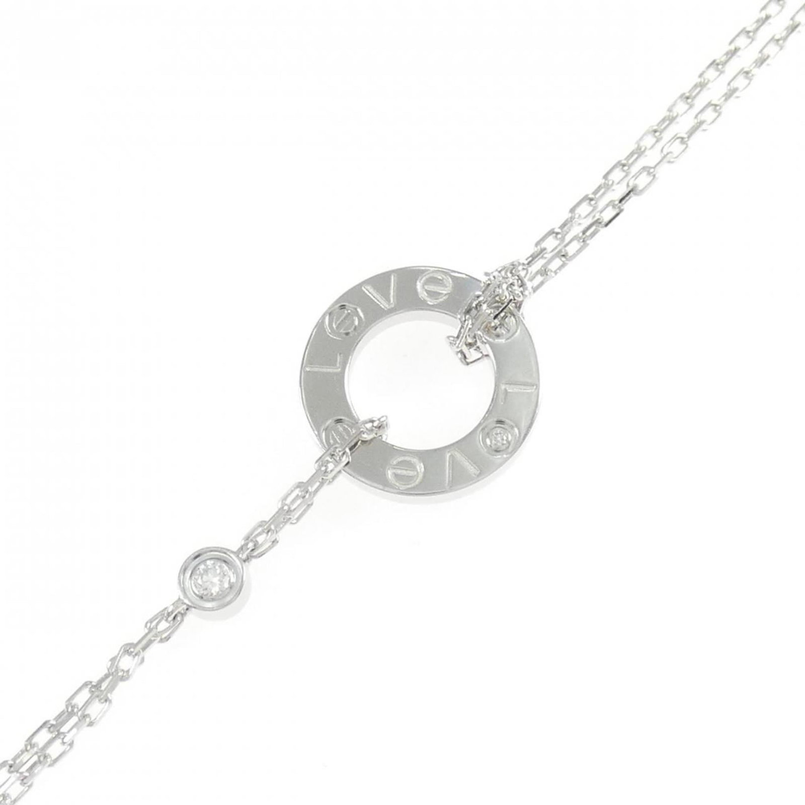 Cartier Charm Bracelet in 18k White Gold: Cartier Charm Bracelet in 18k White Gold A stunning Cartier charm bracelet in 18k white gold, adorned with a sparkling diamond, adds a touch of timeless elegance to any outfit. With its sleek design a