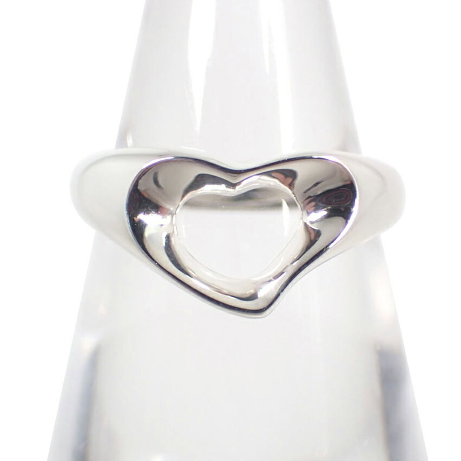 Sterling Silver 925 Tiffany Band Ring: Sterling Silver 925 Tiffany Band Ring A timeless Tiffany band ring in sterling silver 925, this beautiful piece boasts a sleek design that exudes elegance and sophistication. With its classic style an