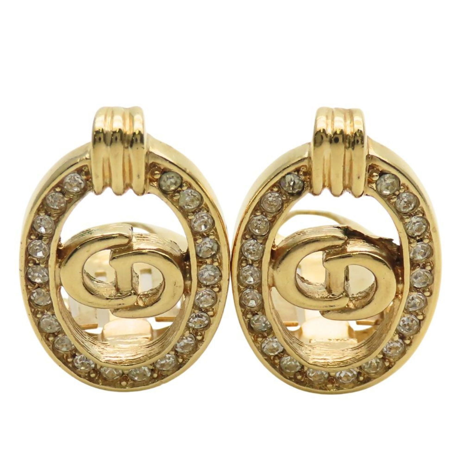 Christian Dior Clip Earrings in Metal: Christian Dior Clip Earrings in Metal Elevate your everyday look with these stunning Christian Dior clip earrings, featuring delicate gold metal and sparkling rhinestones that catch the light. With th