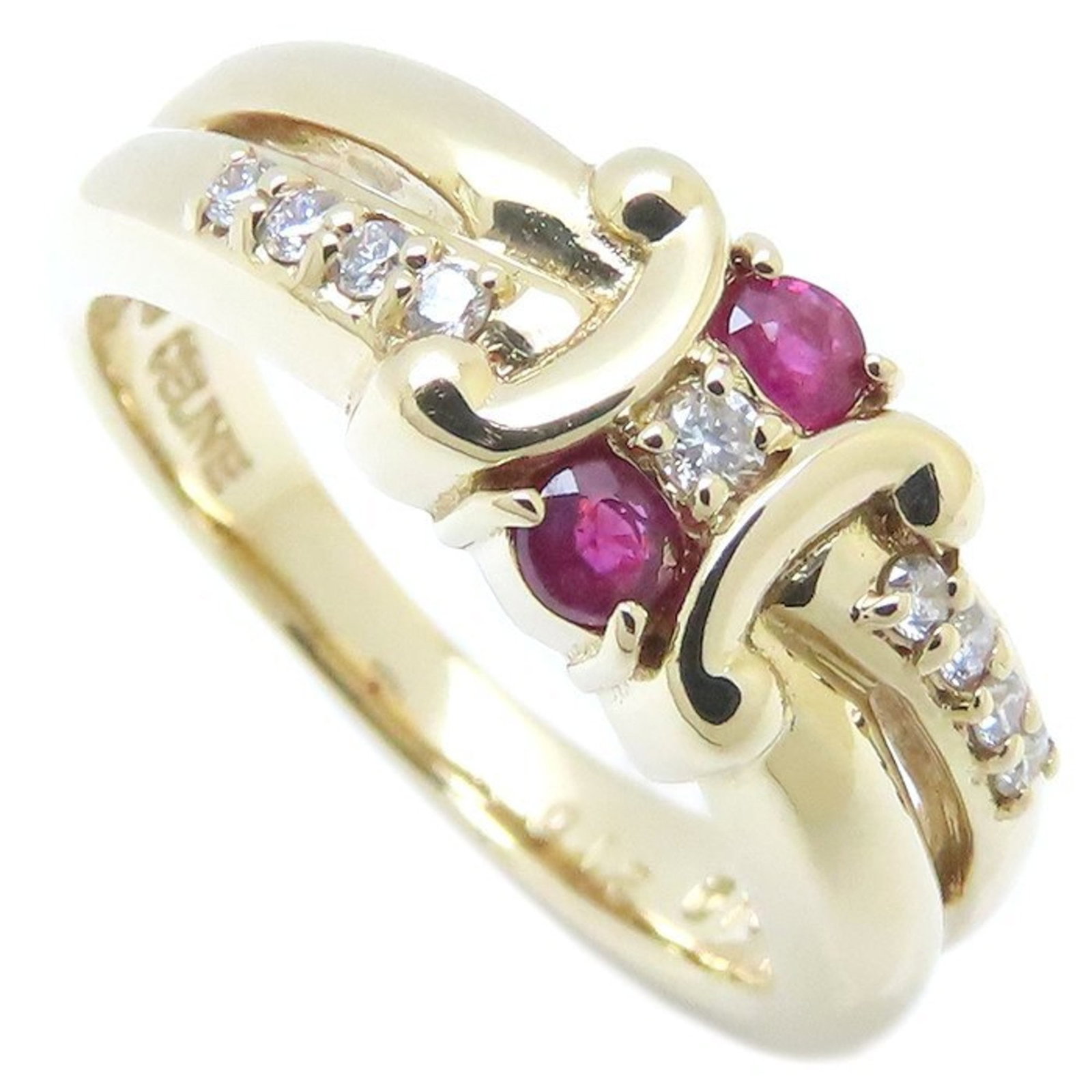 Ring Celine Band: Ring Celine Band Elevate your style with this stunning 18K gold band ring, boasting a vibrant yellow hue and adorned with a beautiful diamond and ruby combination. Its classic design makes it perfect