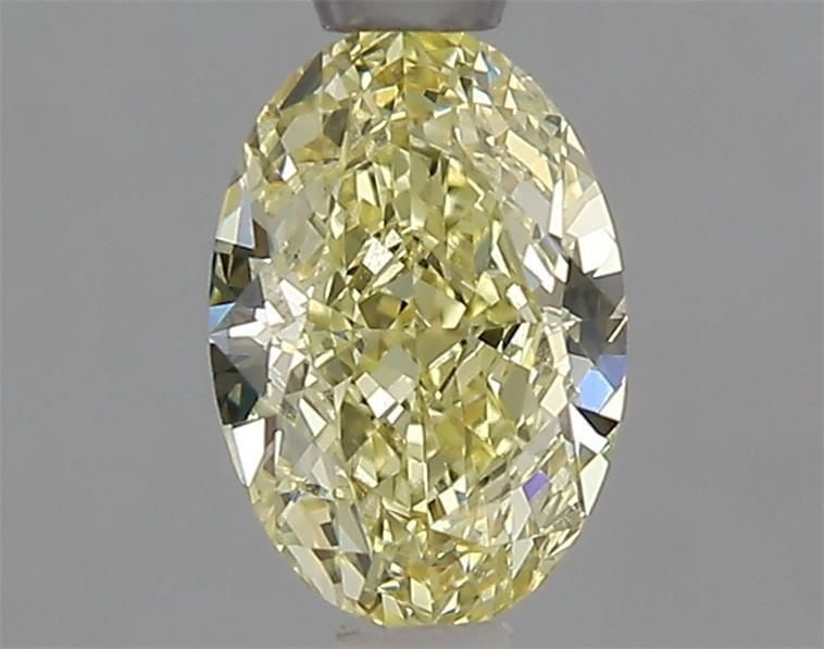 IGI Oval 1.05ct Fancy Yellow VVS1 Loose Lab Diamond: IGI Oval 1.05ct Fancy Yellow VVS1 Loose Lab Diamond A rare and radiant Fancy Yellow diamond, certified by the International Gemological Institute (IGI), boasts exceptional clarity with a VVS1 grade
