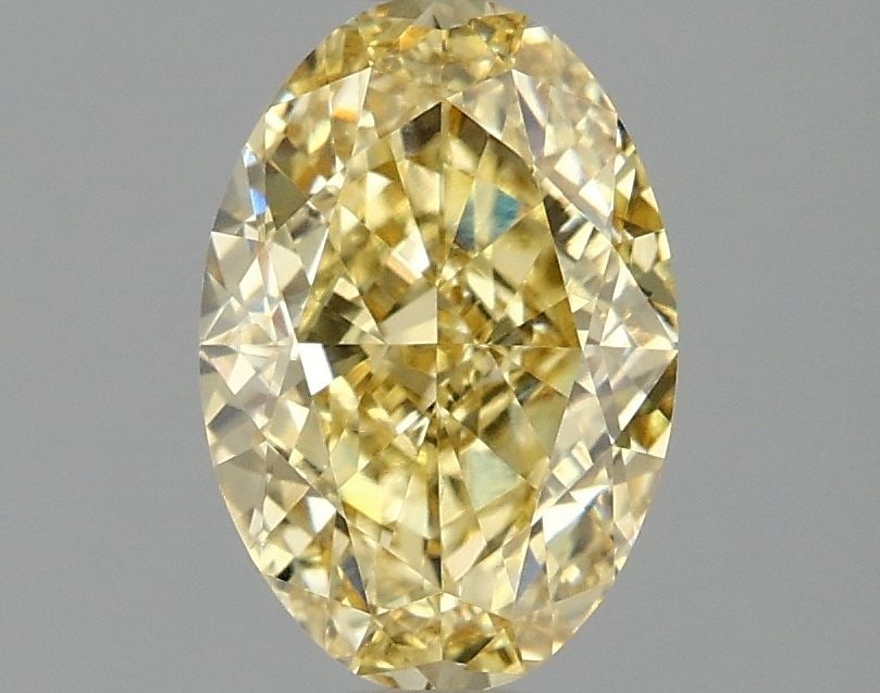 IGI Oval 1.59ct Fancy Intense Yellow VVS2 Loose Lab Diamond: IGI Oval 1.59ct Fancy Intense Yellow VVS2 Loose Lab Diamond A rare and vibrant Fancy Intense Yellow diamond, certified by the International Gemological Institute (IGI), boasts exceptional clarity and