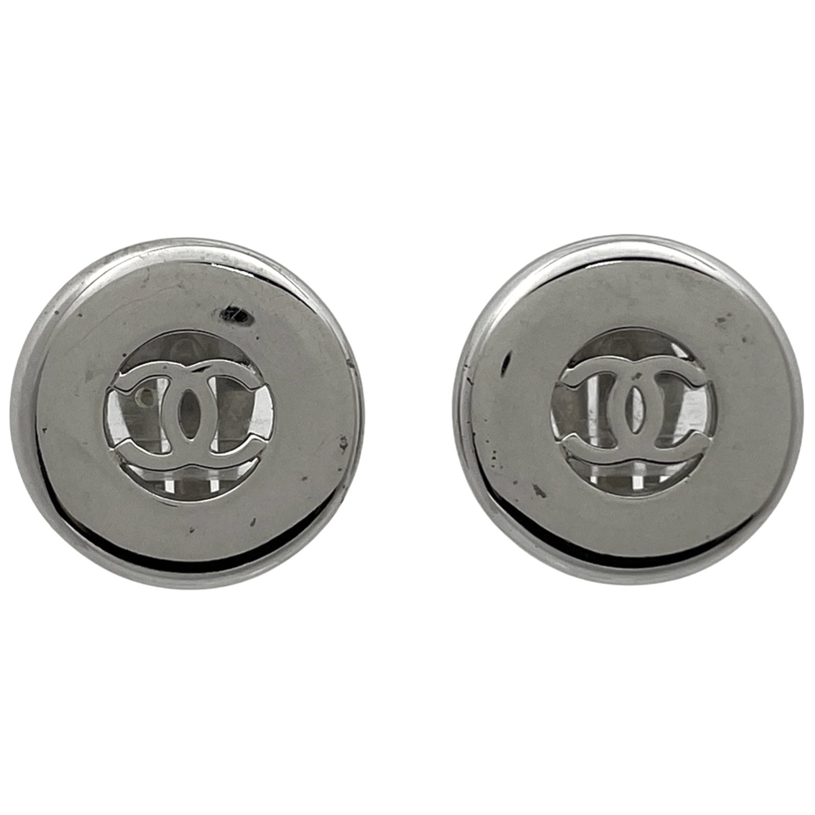 Earrings Chanel Clip: Earrings Chanel Clip Add a touch of timeless elegance to your outfit with these authentic Chanel clip earrings, featuring the iconic interlocking CC logo in sleek silver. With their classic design
