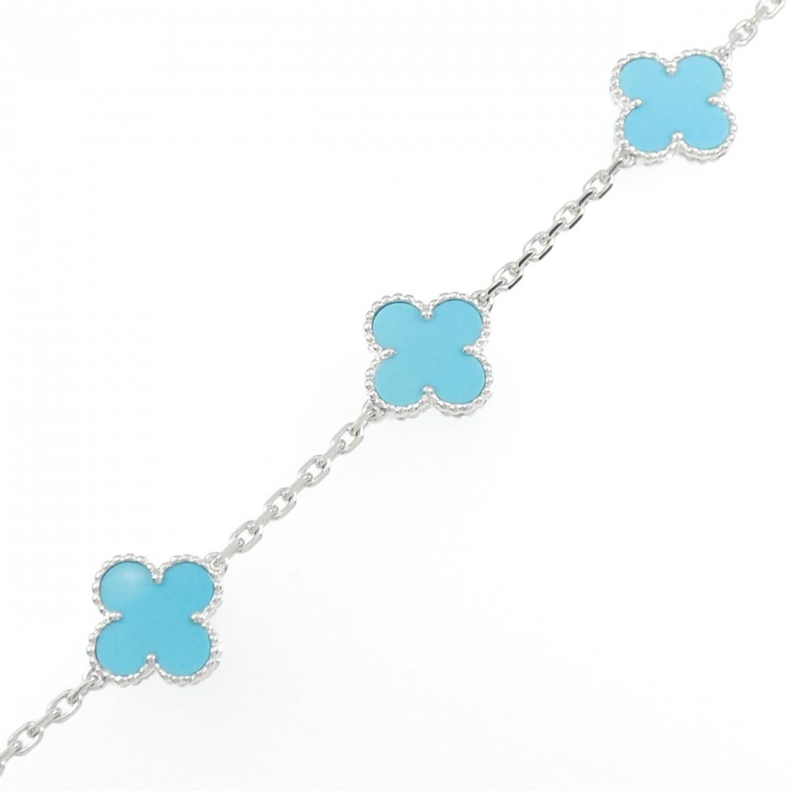 Van Cleef & Arpels 18K White Gold Charm Bracelet: Van Cleef & Arpels 18K White Gold Charm Bracelet Elevate your style with the iconic Van Cleef & Arpels charm bracelet, crafted from 18K white gold and adorned with a stunning turquoise stone. This exq