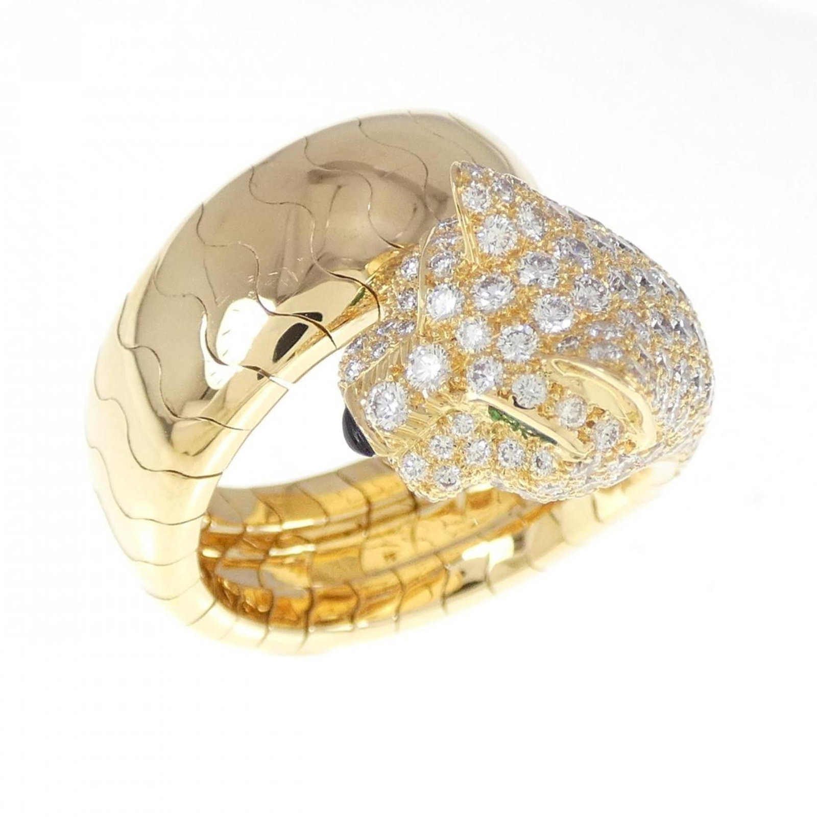 Cartier 18k Yellow Gold Band Ring: Cartier 18k Yellow Gold Band Ring A stunning Cartier band ring in 18k yellow gold, adorned with a beautiful diamond, emerald, and onyx combination, adds a touch of luxury to any outfit. This pre-loved