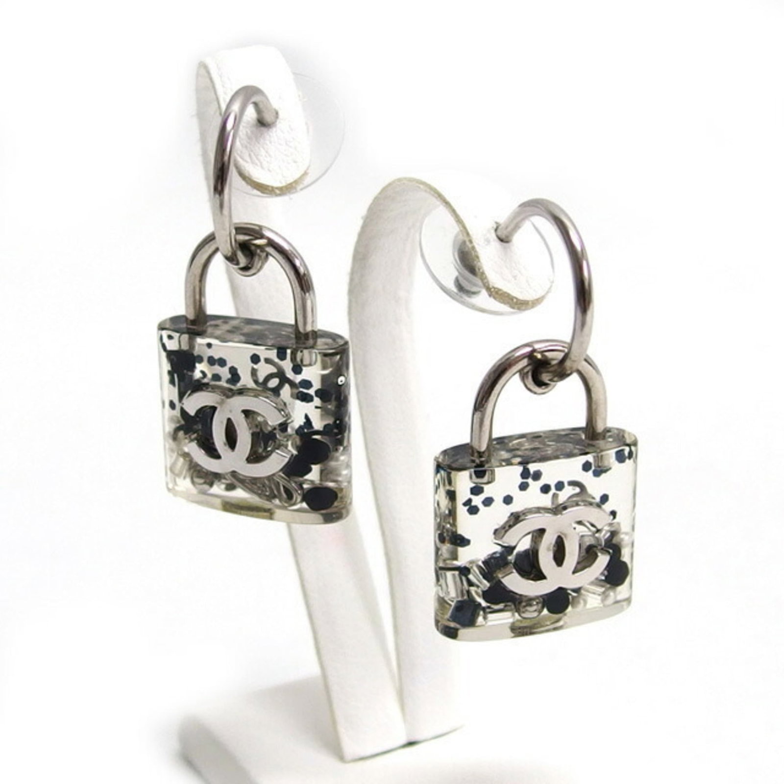 Chanel Stud Earrings - Metal & Resin: Chanel Stud Earrings - Metal & Resin Elevate your everyday style with these iconic Chanel stud earrings, crafted from durable metal and resin in sleek silver. With their understated elegance and timel