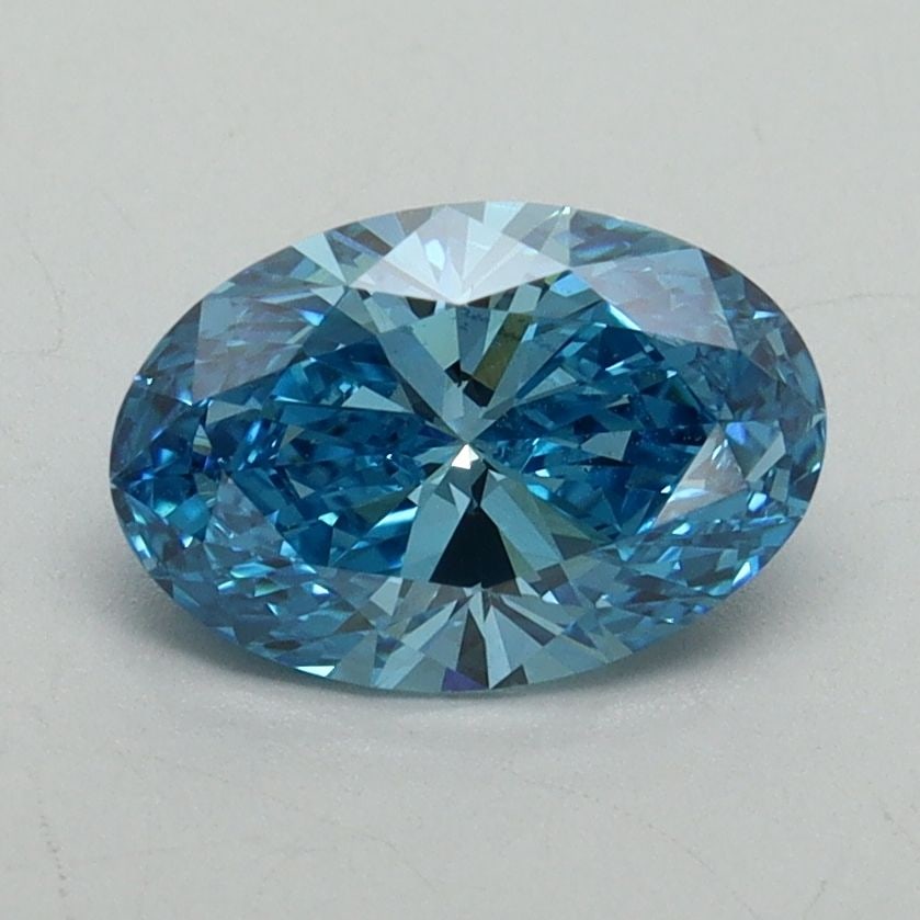 IGI Oval 1.27ct Fancy Vivid Blue VVS2 Loose Lab Diamond: IGI Oval 1.27ct Fancy Vivid Blue VVS2 Loose Lab Diamond Experience the breathtaking beauty of a lab-grown Fancy Vivid Blue diamond, certified by IGI as VVS2 in clarity and EX in polish and symmetry. T