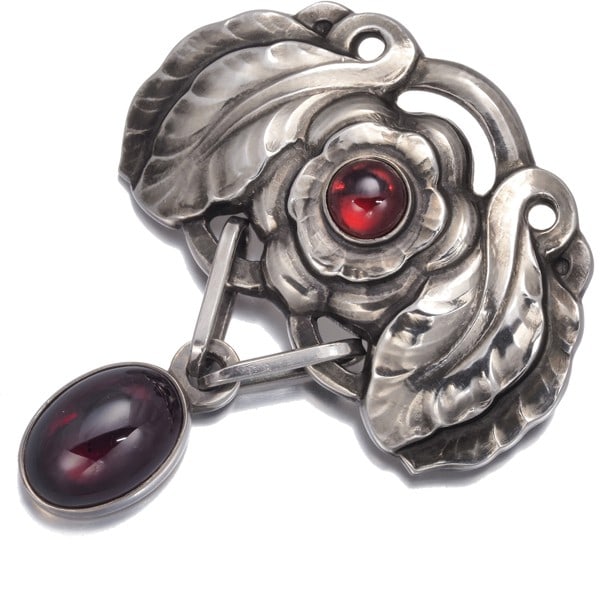 Silver Georg Jensen Brooch Garnet 193 925 Sterling: Silver Georg Jensen Brooch Garnet 193 925 Sterling A stunning silver brooch from renowned Danish designer Georg Jensen, this 193-style piece showcases a natural garnet stone set in high-quality sterli