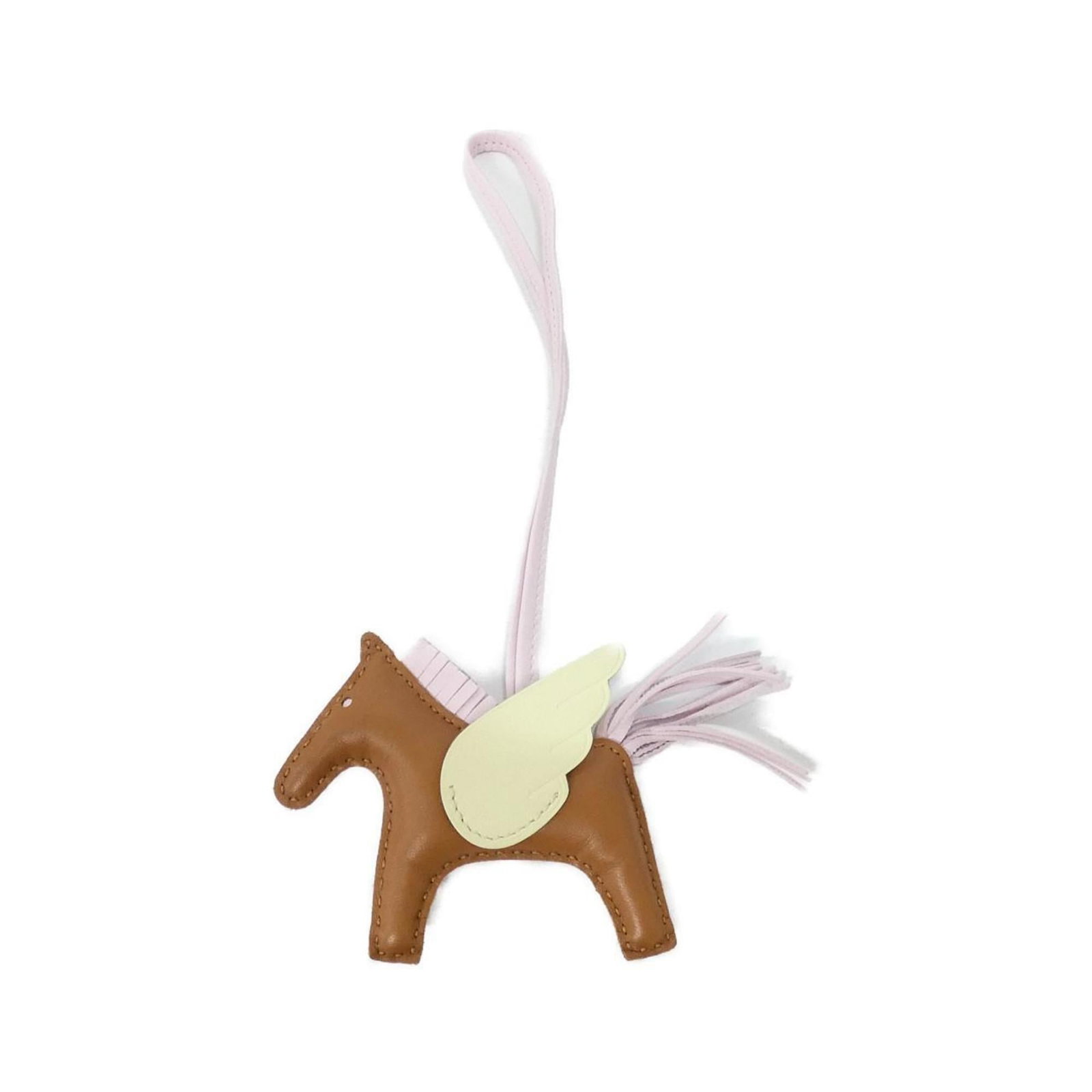 Hermes Agneau Milo Handbag Charm: Hermes Agneau Milo Handbag Charm A rare and elegant Hermes Agneau Milo handbag charm, this brown beauty boasts the iconic Agneau Milo material, known for its exceptional quality and luxurious feel. Wi