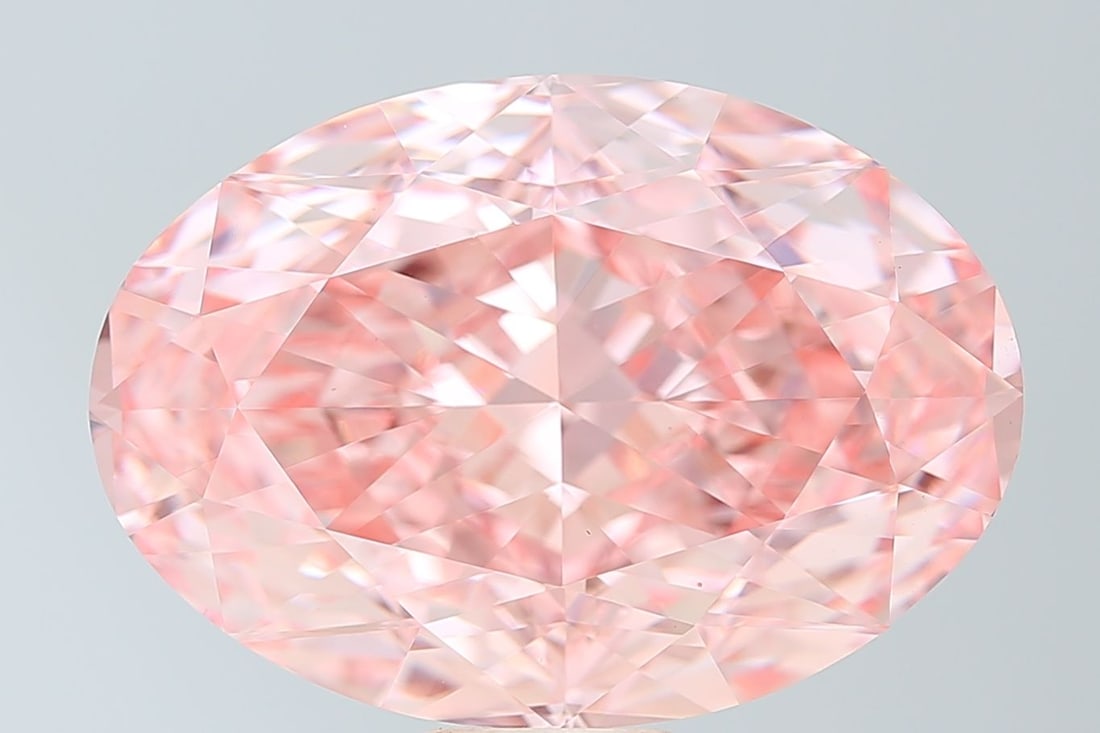 IGI Oval 22.13ct Fancy Vivid Pink VVS2 Loose Lab Diamond: IGI Oval 22.13ct Fancy Vivid Pink VVS2 Loose Lab Diamond Experience the breathtaking beauty of a lab-grown diamond, certified by the International Gemological Institute (IGI) as Fancy Vivid Pink with