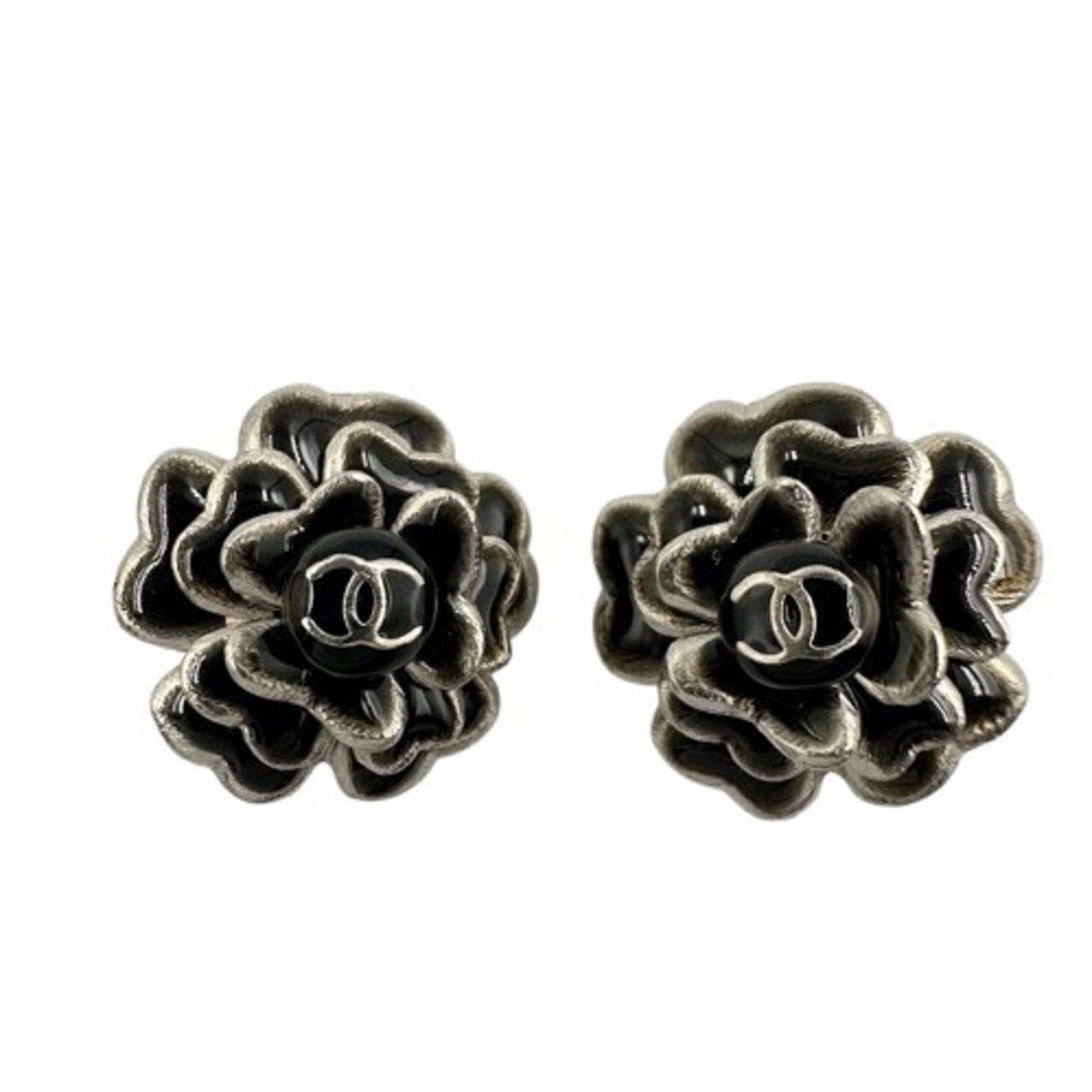 Chanel Clip Earrings in Metal: Chanel Clip Earrings in Metal Elevate your everyday look with these sleek Chanel clip earrings in black metal. Made from high-quality metal, these chic earring clips are perfect for adding a touch of