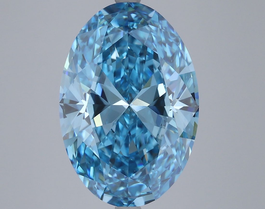 IGI Oval 7.04ct Fancy Vivid Blue VVS2 Loose Lab Diamond: IGI Oval 7.04ct Fancy Vivid Blue VVS2 Loose Lab Diamond Experience the breathtaking beauty of a Fancy Vivid Blue diamond, one of the rarest and most coveted colors in nature. This stunning 7.04ct