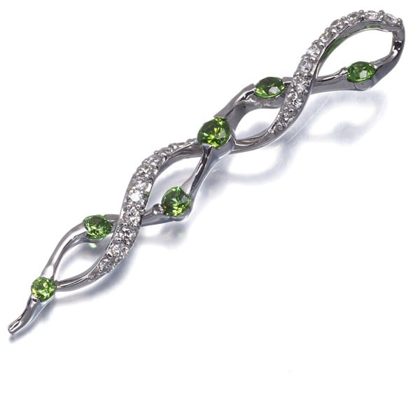 Gold Demantoid Garnet 0.55Ct Diamond 0.25Ct Pendant 18K 750 White: Gold Demantoid Garnet 0.55Ct Diamond 0.25Ct Pendant 18K 750 White A stunning natural demantoid garnet, set alongside a sparkling 0.25ct diamond, is showcased in an elegant 18k white gold pendant. The
