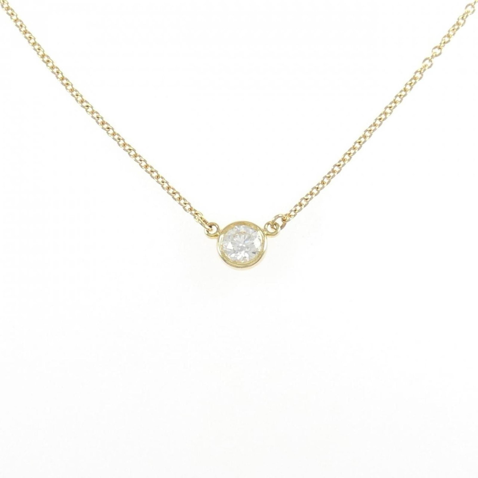 EXT Tiffany By the Yard Necklace 0.19CT G VVS2: EXT Tiffany By the Yard Necklace 0.19CT G VVS2 A stunning 18K yellow gold Tiffany necklace, boasting a beautiful 0.19ct diamond pendant set in a G VVS2 clarity, making it a rare and precious find for