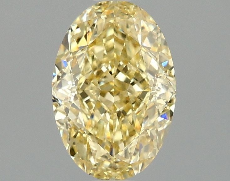 IGI Oval 1.57ct Fancy Intense Yellow VVS2 Loose Lab Diamond: IGI Oval 1.57ct Fancy Intense Yellow VVS2 Loose Lab Diamond Experience the vibrant beauty of nature in this stunning 1.57ct Fancy Intense Yellow VVS2 lab-grown diamond, boasting exceptional clarity an