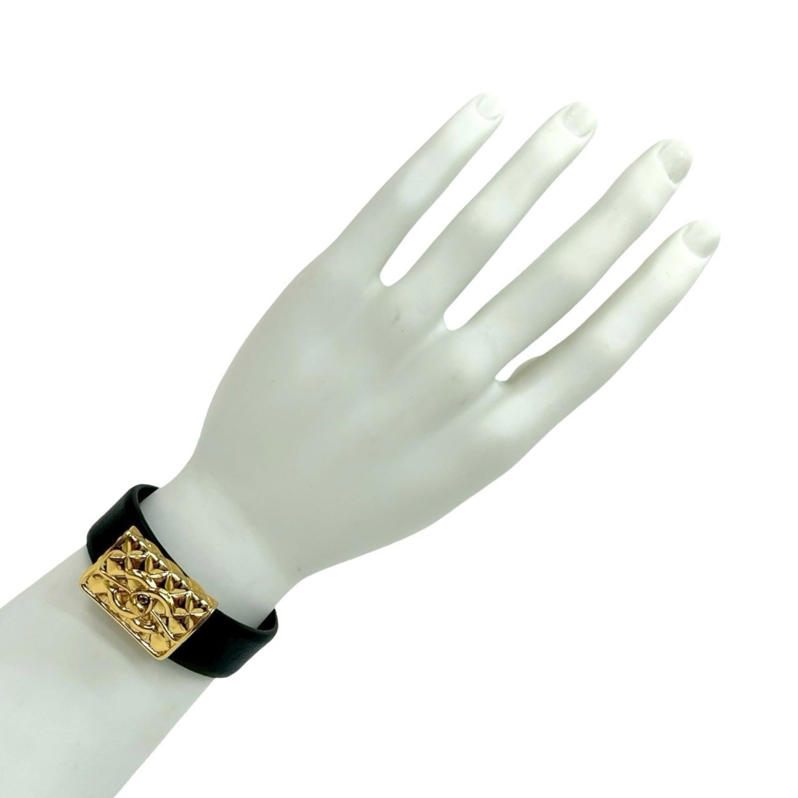 Leather - Chanel Bangle Gold Plating: Leather - Chanel Bangle Gold Plating A sleek and sophisticated Chanel bangle, this gold-plated beauty adds a touch of luxury to any outfit with its understated elegance. Made from high-quality leather