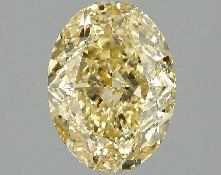 IGI Oval 2.02ct Fancy Vivid Yellow VVS2 Loose Lab Diamond: IGI Oval 2.02ct Fancy Vivid Yellow VVS2 Loose Lab Diamond Experience the vibrant beauty of nature in this stunning 2.02ct Fancy Vivid Yellow VVS2 lab-grown diamond, certified by the International Gemo