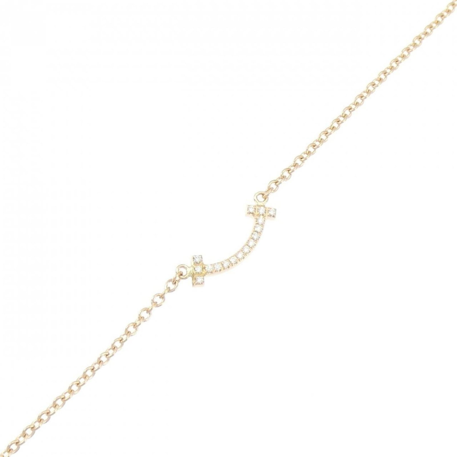 Pink Gold 18K Tiffany Charm Bracelet: Pink Gold 18K Tiffany Charm Bracelet Elevate your style with the iconic Tiffany charm bracelet, crafted from luxurious 18K pink gold and adorned with sparkling diamonds. This pre-loved beauty boasts a