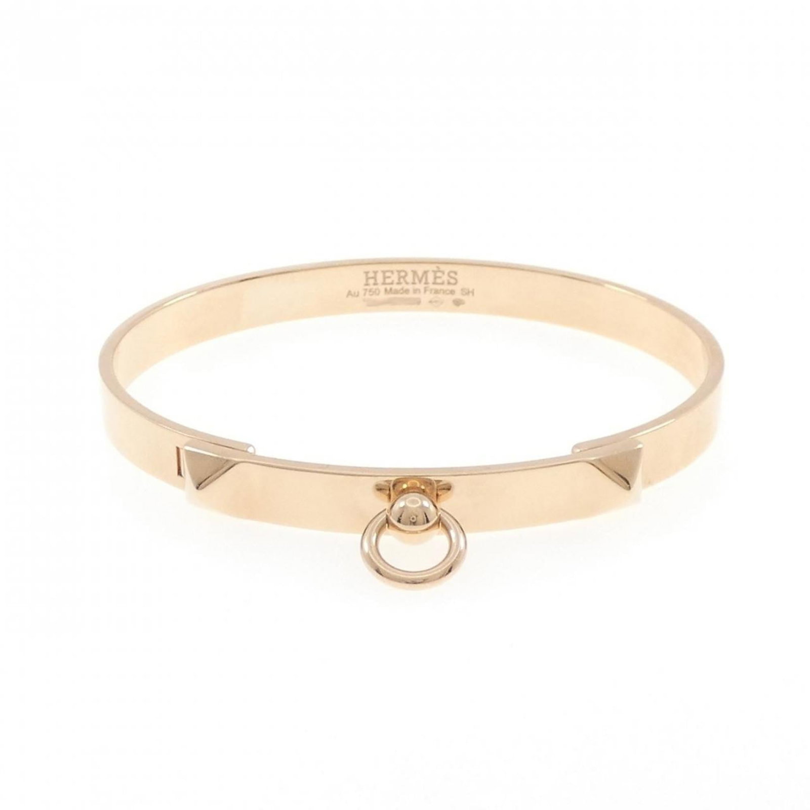 Pink Gold 18K Hermes Bangle: Pink Gold 18K Hermes Bangle Elevate your style with the iconic 18K pink gold Hermes bangle, boasting a sleek and sophisticated design that exudes luxury. This high-quality, used (like new) piece is ha