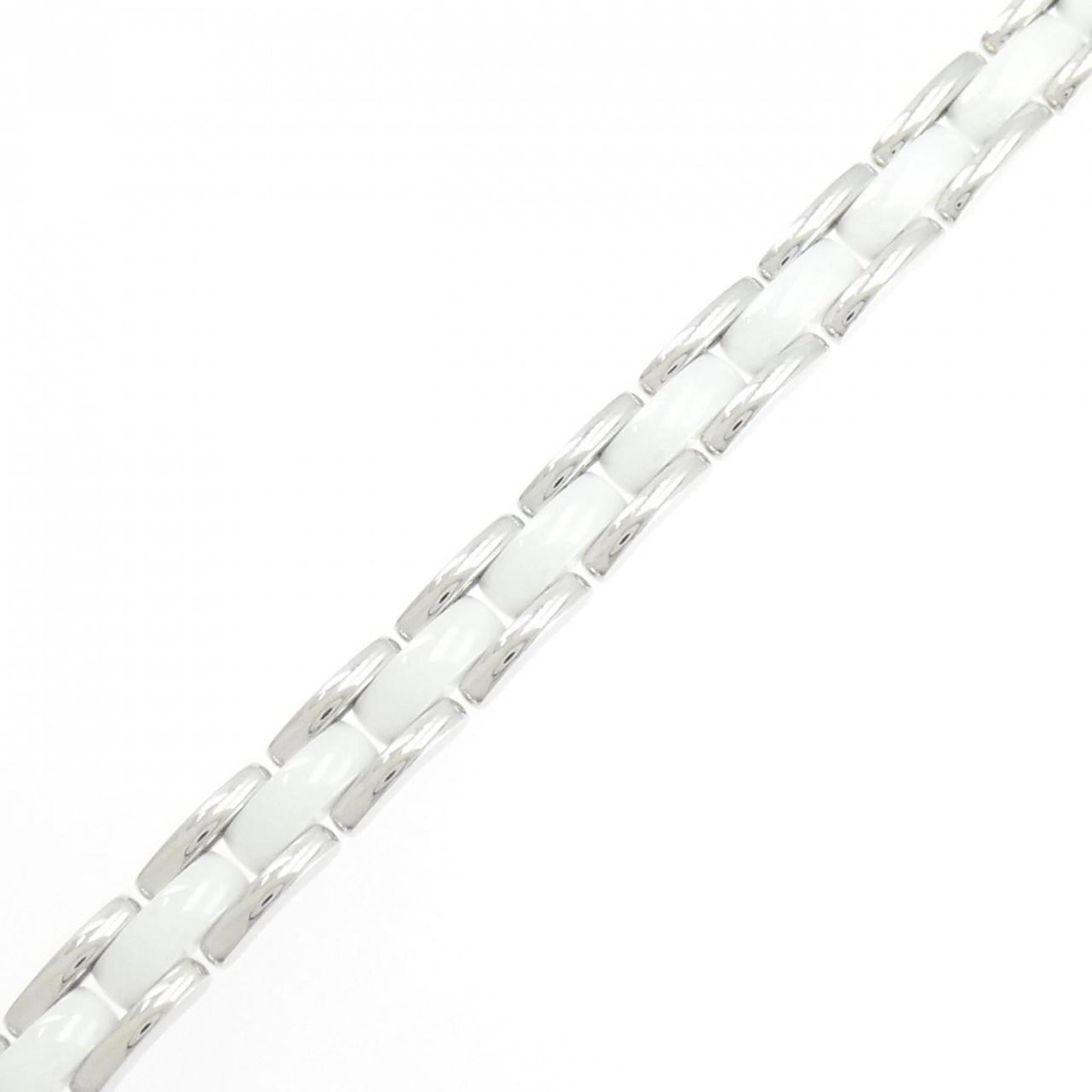 White Gold (18K) - Chanel Charm Bracelet Ceramic: White Gold (18K) - Chanel Charm Bracelet Ceramic A rare find for the Chanel enthusiast, this 18K white gold charm bracelet boasts a striking ceramic design that adds a touch of elegance to any outfit.