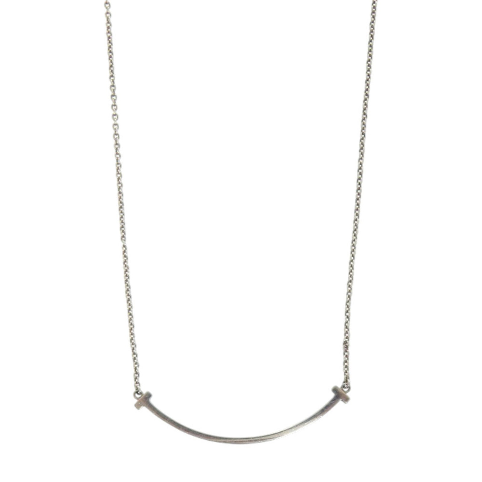 1494 Excellent condition Tiffany T Smile Small Silver 925 Necklace: 1494 Excellent condition Tiffany T Smile Small Silver 925 Necklace A stunning Tiffany & Co. silver necklace, crafted from 925 sterling silver, boasts a delicate T Smile pendant that adds a touch of el