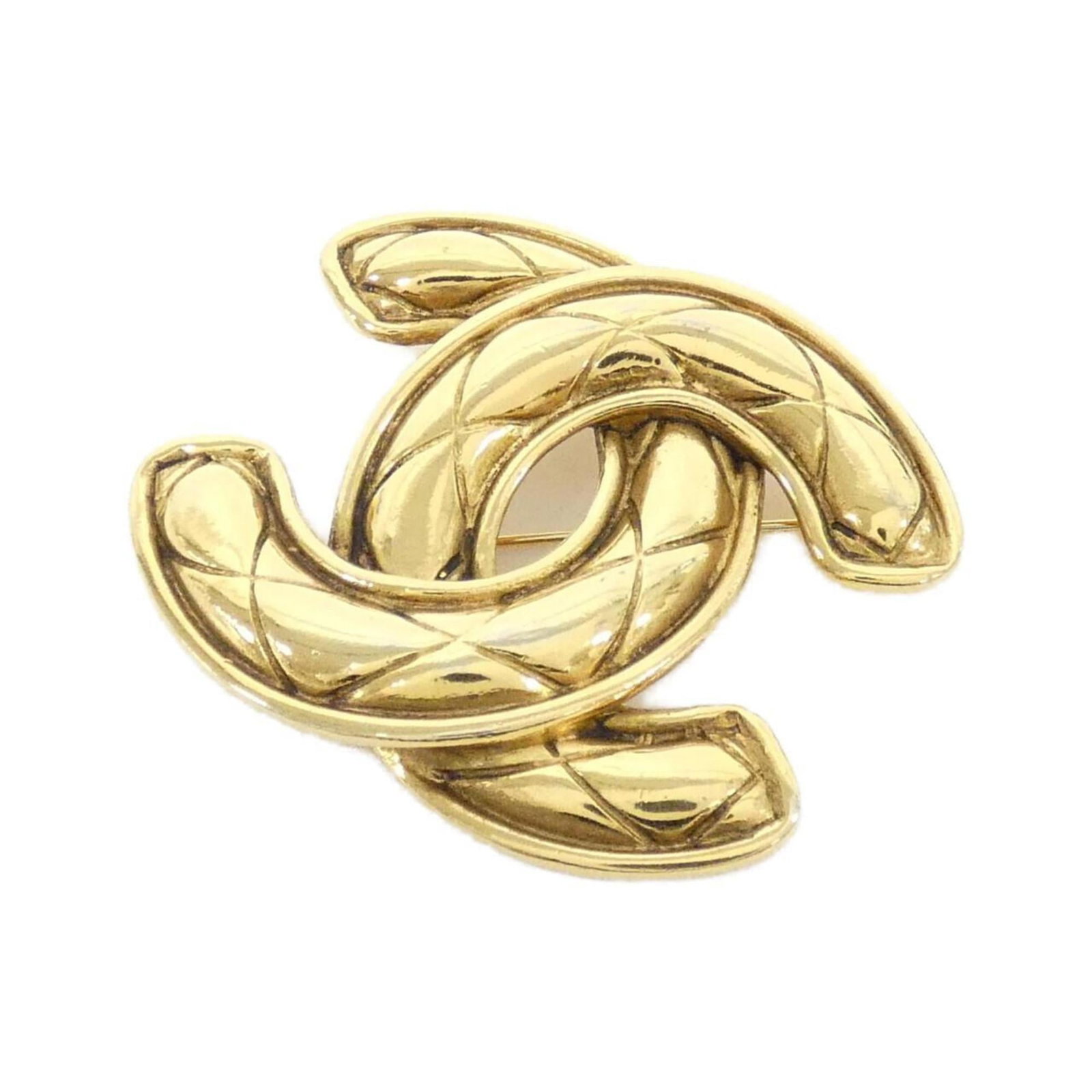 Brooch Chanel: Brooch Chanel A stunning Chanel brooch, this gold piece is a timeless addition to any outfit, boasting the iconic brand's signature style and craftsmanship. With its elegant design and subtle scratche