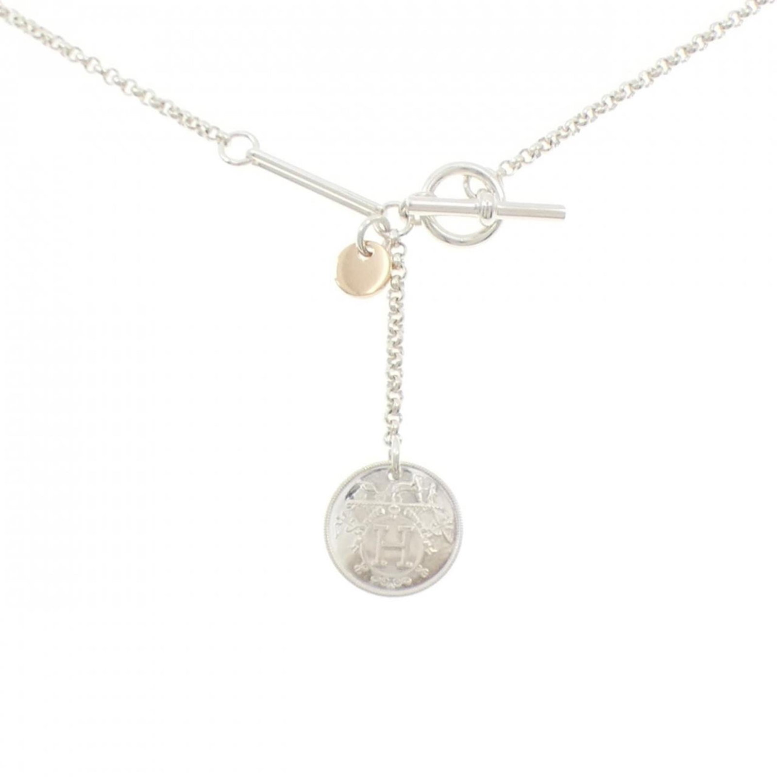 Necklace Hermes Herms Ex Libris: Necklace Hermes Herms Ex Libris A stunning Hermes Ex Libris necklace, crafted in 18K pink gold and sterling silver, adds a touch of elegance to any outfit. With its unique design and high-quality mate