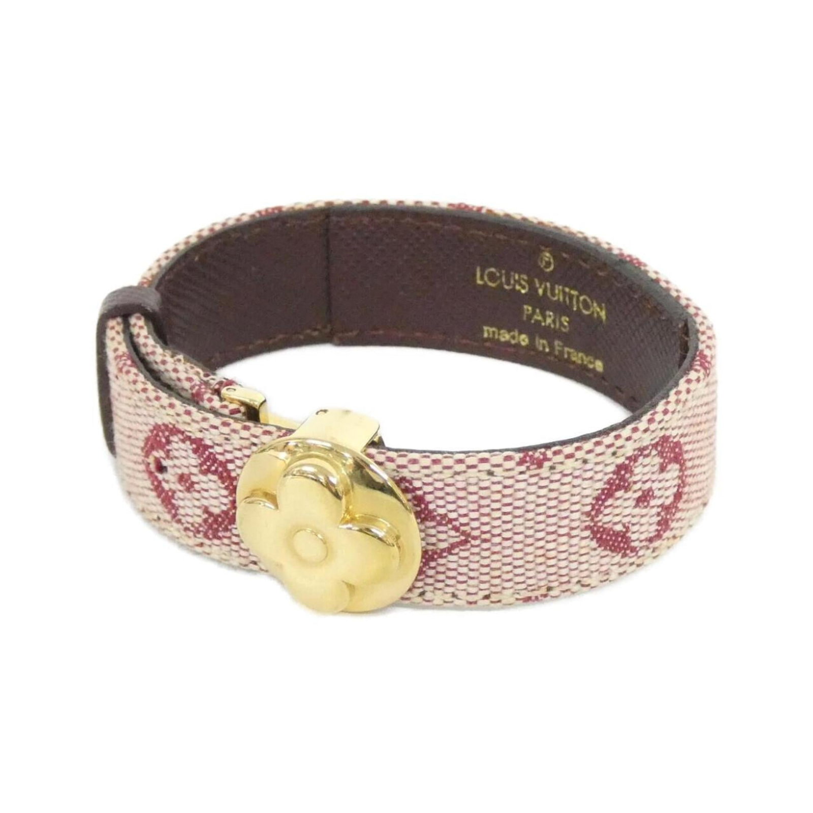 Louis Vuitton Canvas Charm Bracelet: Louis Vuitton Canvas Charm Bracelet Add a touch of timeless elegance to your wrist with this pre-loved Louis Vuitton canvas charm bracelet. Made from durable canvas, this iconic accessory boasts the s