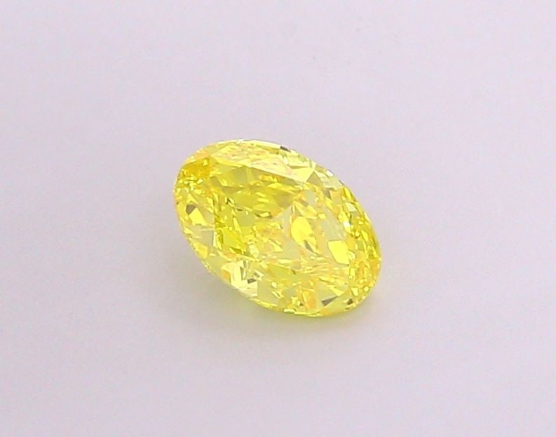 IGI Oval 1.09ct Fancy Vivid Yellow VVS1 Loose Lab Diamond: IGI Oval 1.09ct Fancy Vivid Yellow VVS1 Loose Lab Diamond Experience the vibrant beauty of nature with this stunning 1.09ct Fancy Vivid Yellow VVS1 loose lab diamond, certified by the International Ge