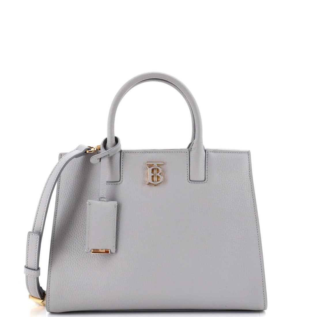 Burberry Mini Leather Tote: Burberry Mini Leather Tote Experience the timeless elegance of Burberry's iconic mini leather tote, crafted from high-quality gray leather that exudes sophistication and poise. With its classic should