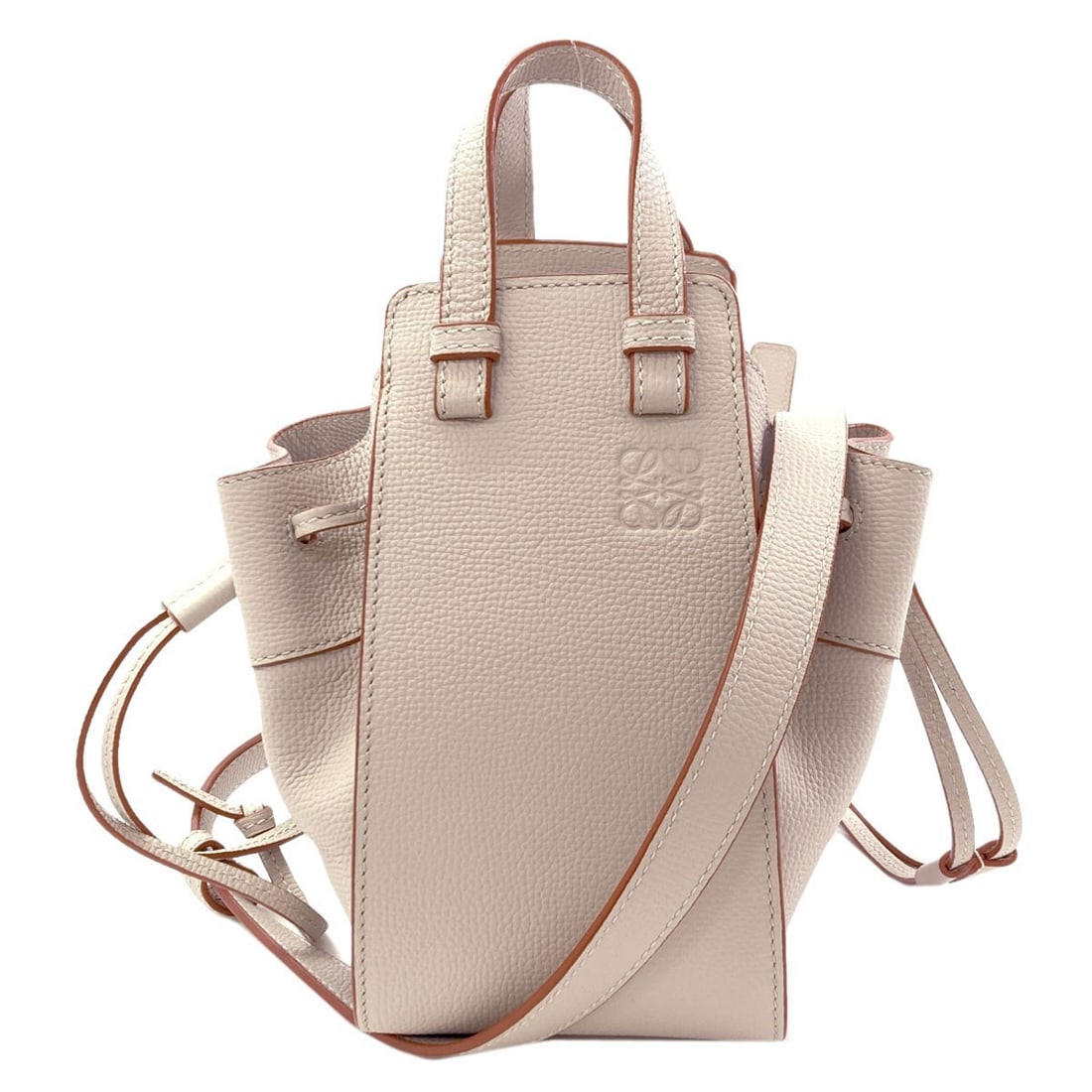 Calf LOEWE Hammock mini 2WAY Handbag: Calf LOEWE Hammock mini 2WAY Handbag Elevate your everyday with the understated elegance of LOEWE's Calf mini handbag, crafted from supple beige calfskin that exudes sophistication and refinement. The