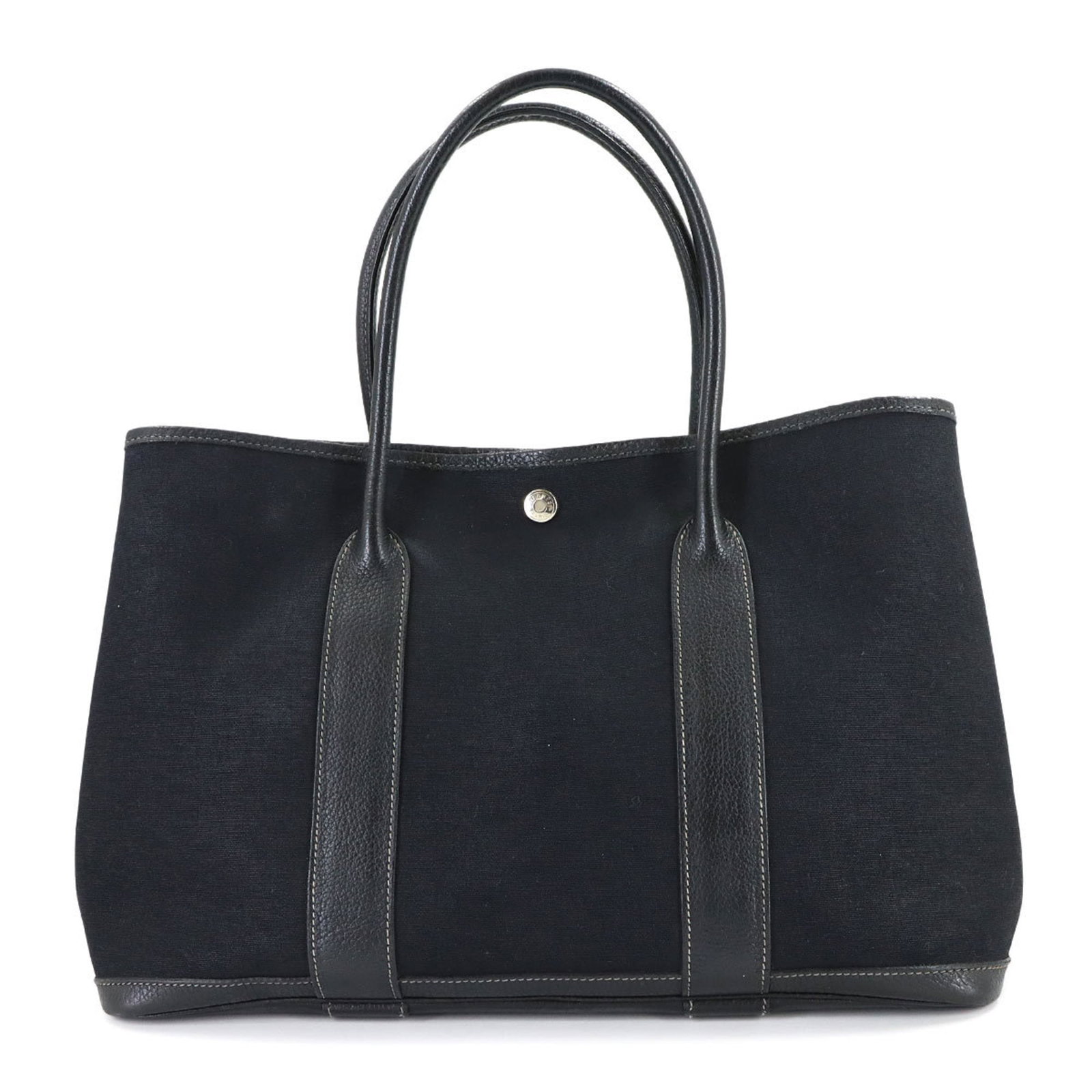 Hermes Tote Bag Toile Officier Leather: Hermes Tote Bag Toile Officier Leather Experience the timeless elegance of Herm?s with this stunning Toile Officier leather tote bag, boasting classic black color and rich, supple leather that develop