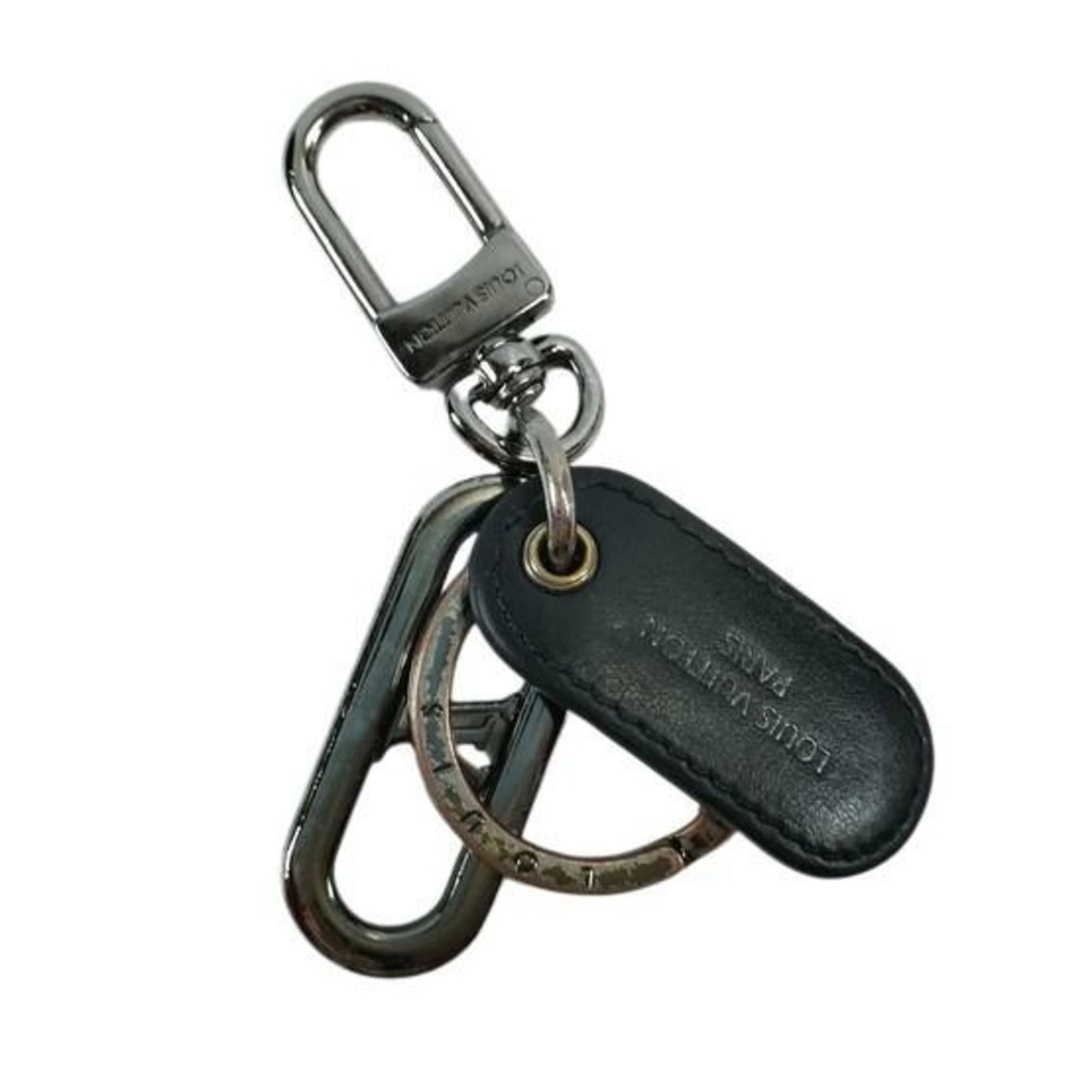 Louis Vuitton Monogram Eclipse Keyring: Louis Vuitton Monogram Eclipse Keyring Elevate your everyday carry with the iconic Louis Vuitton Monogram Eclipse Keyring, boasting the signature interlocking LV monograms in sleek black metal. This s
