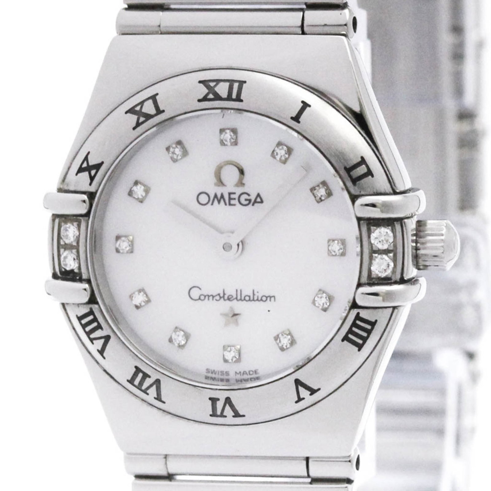 Wristwatch Omega: Wristwatch Omega A pre-owned Omega wristwatch in excellent condition, boasting a sleek stainless steel case and band that exudes sophistication and elegance. The crisp white dial adds a touch of class
