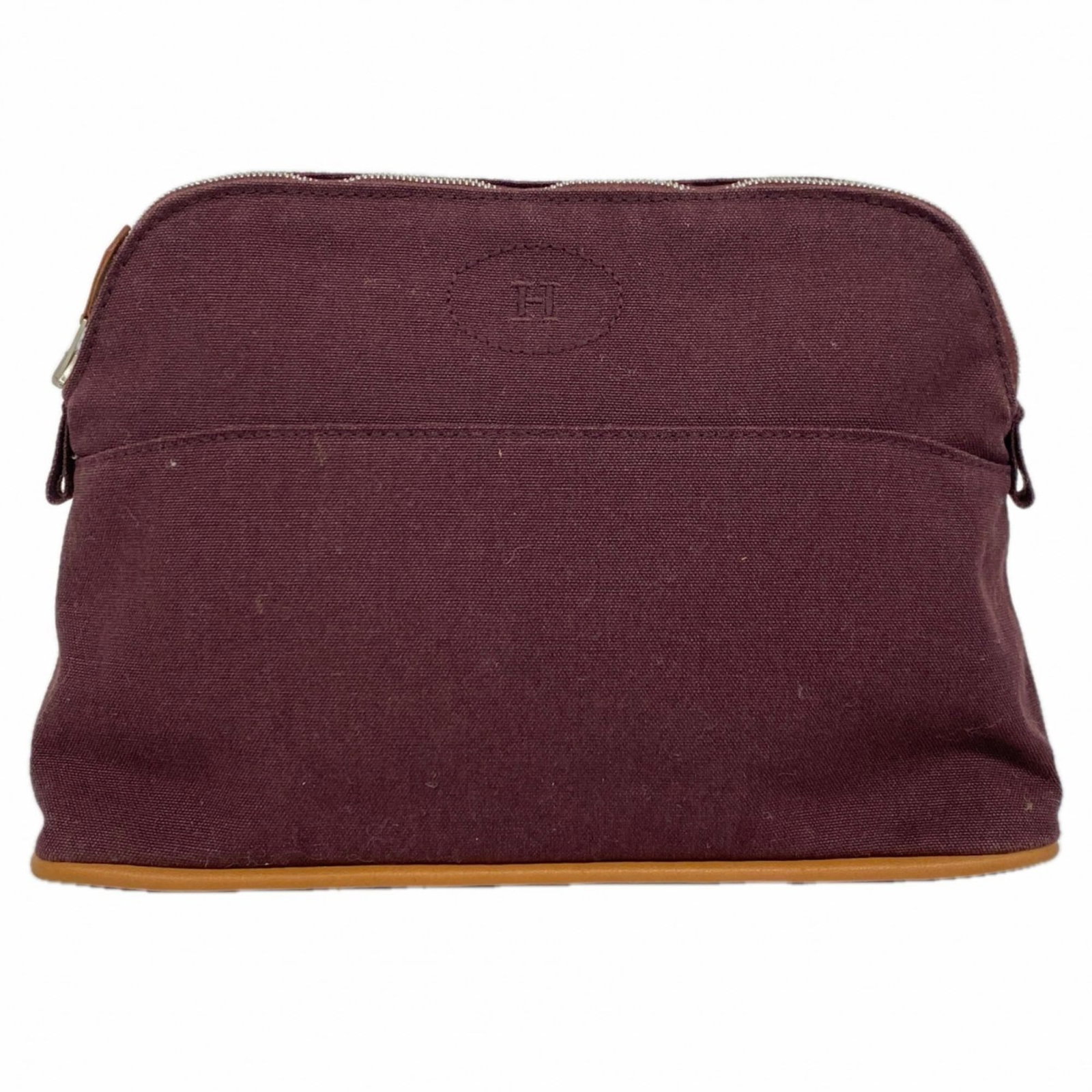 Hermes Pouch in Canvas: Hermes Pouch in Canvas A pre-owned Hermes pouch in rich Bordeaux canvas, adorned with elegant silver hardware, adds a touch of sophisticated luxury to any outfit. Its classic design and timeless color