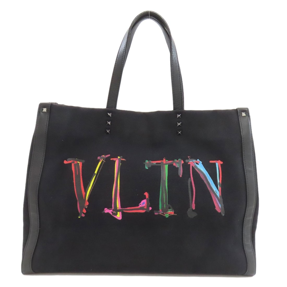 Canvas VALENTINO Studs Tote Bag: Canvas VALENTINO Studs Tote Bag Elevate your everyday style with the sleek and sophisticated VALENTINO Canvas Tote Bag, crafted from high-quality black canvas for a chic and timeless look. The