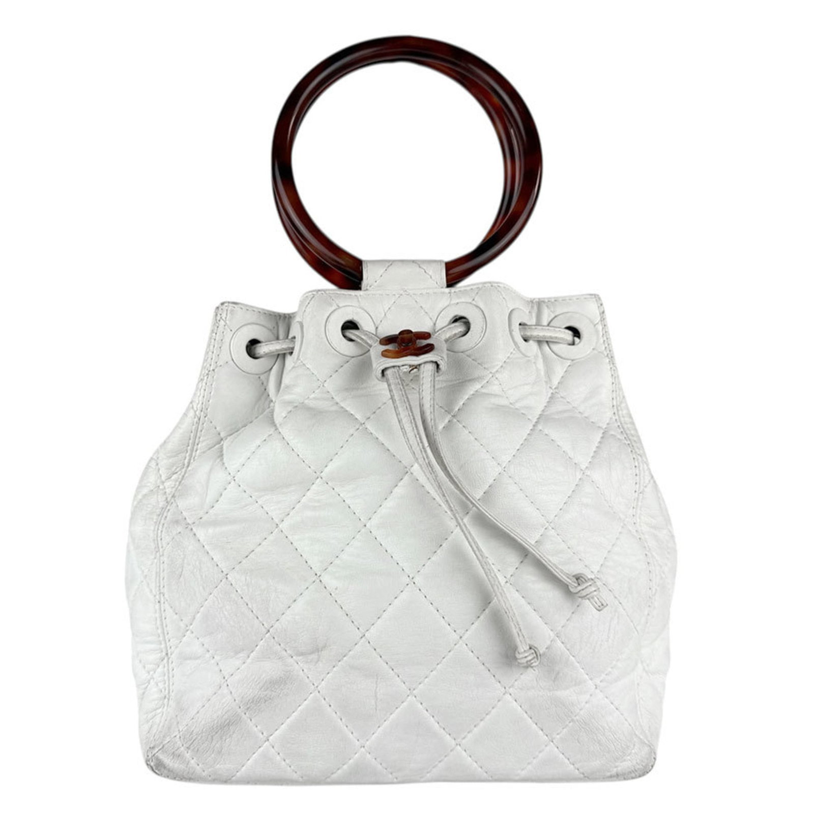Chanel Handbag - Leather and Acrylic: Chanel Handbag - Leather and Acrylic A vintage Chanel handbag in pristine white leather, with a sleek and modern design that exudes timeless elegance. This iconic bag boasts a unique combination of