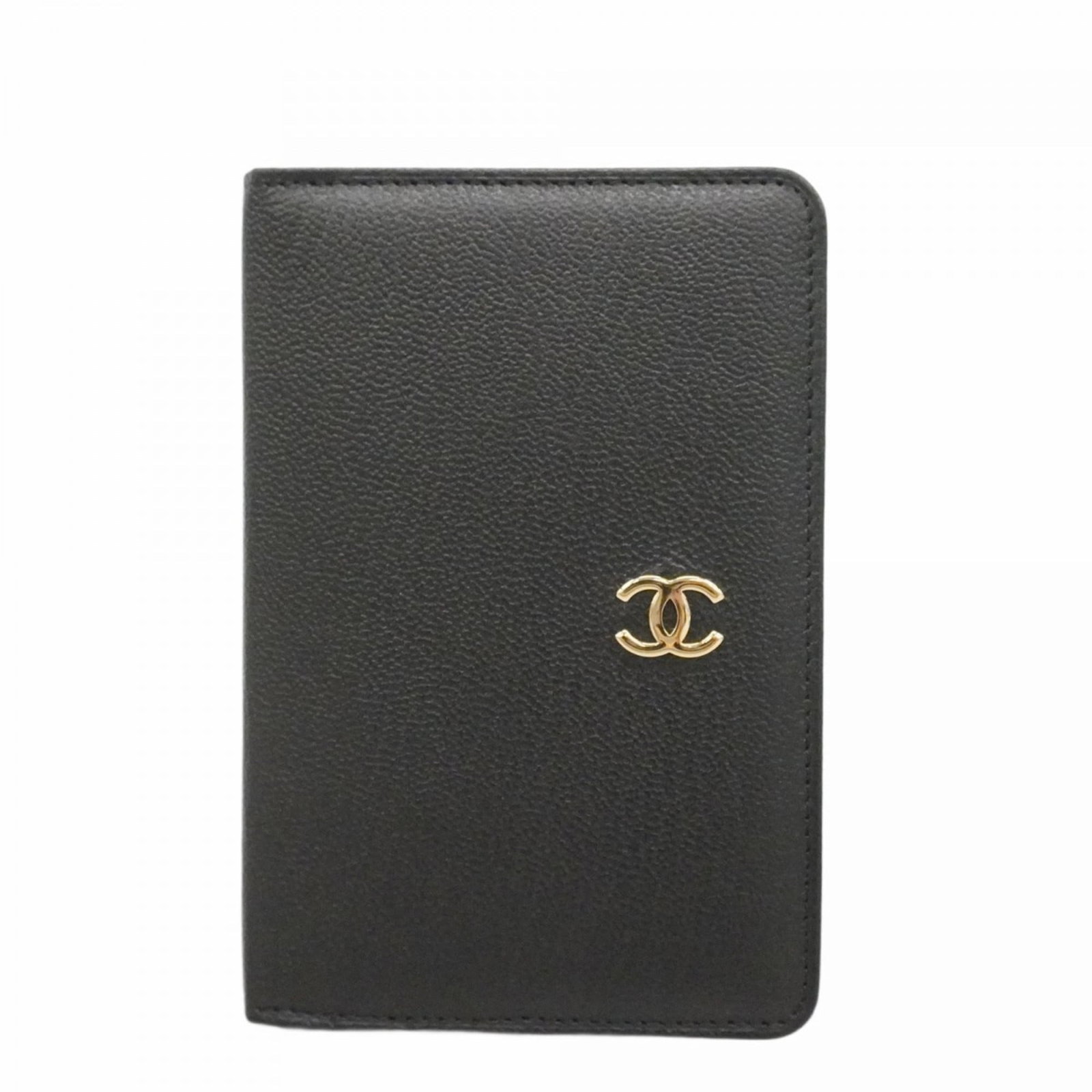 Chanel Women's Black and Champagne Leather Notebook Cover: Chanel Women's Black and Champagne Leather Notebook Cover Elevate your writing style with the timeless elegance of a Chanel notebook cover, crafted from rich black leather and adorned with subtle cham