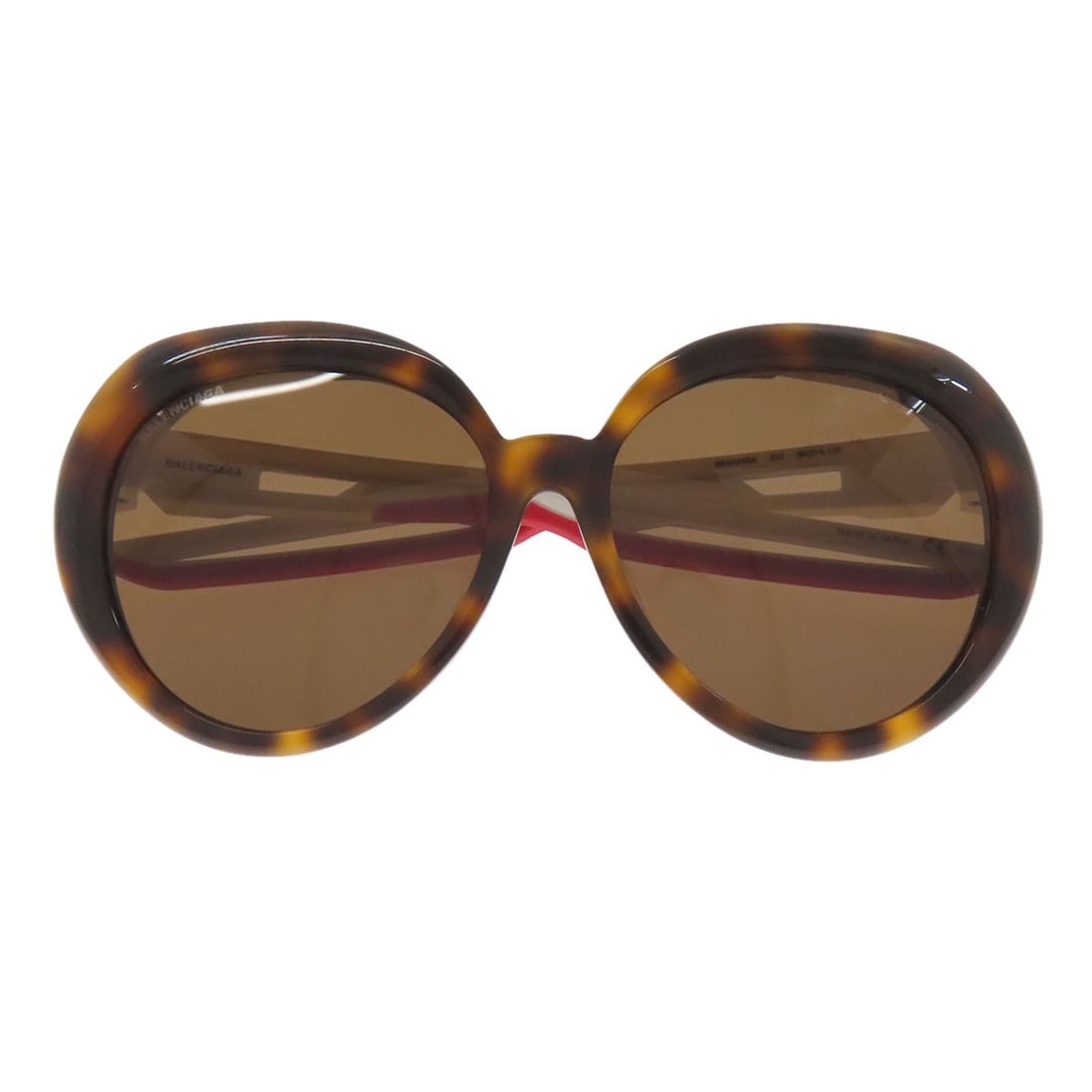 Balenciaga Logo Sunglasses - Plastic: Balenciaga Logo Sunglasses - Plastic Elevate your style with the iconic Balenciaga logo sunglasses, crafted from high-quality plastic and boasting a timeless brown and white color combination that add