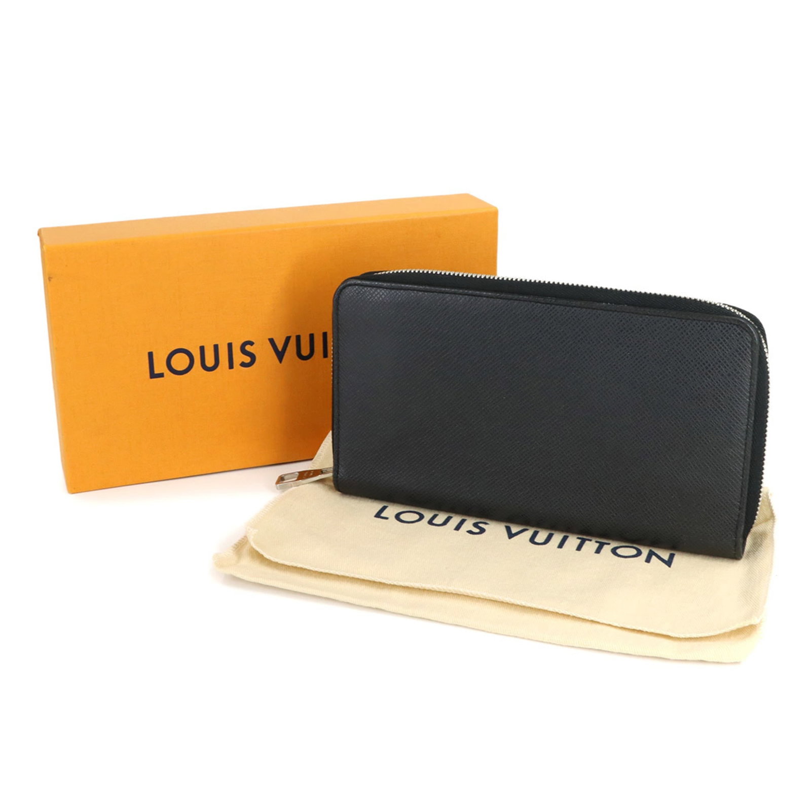 Louis Vuitton Bi-Fold Wallet in Taiga Leather: Louis Vuitton Bi-Fold Wallet in Taiga Leather A timeless piece from the iconic Louis Vuitton, this Bi-Fold Wallet in Taiga Leather exudes understated elegance with its classic design and premium mater