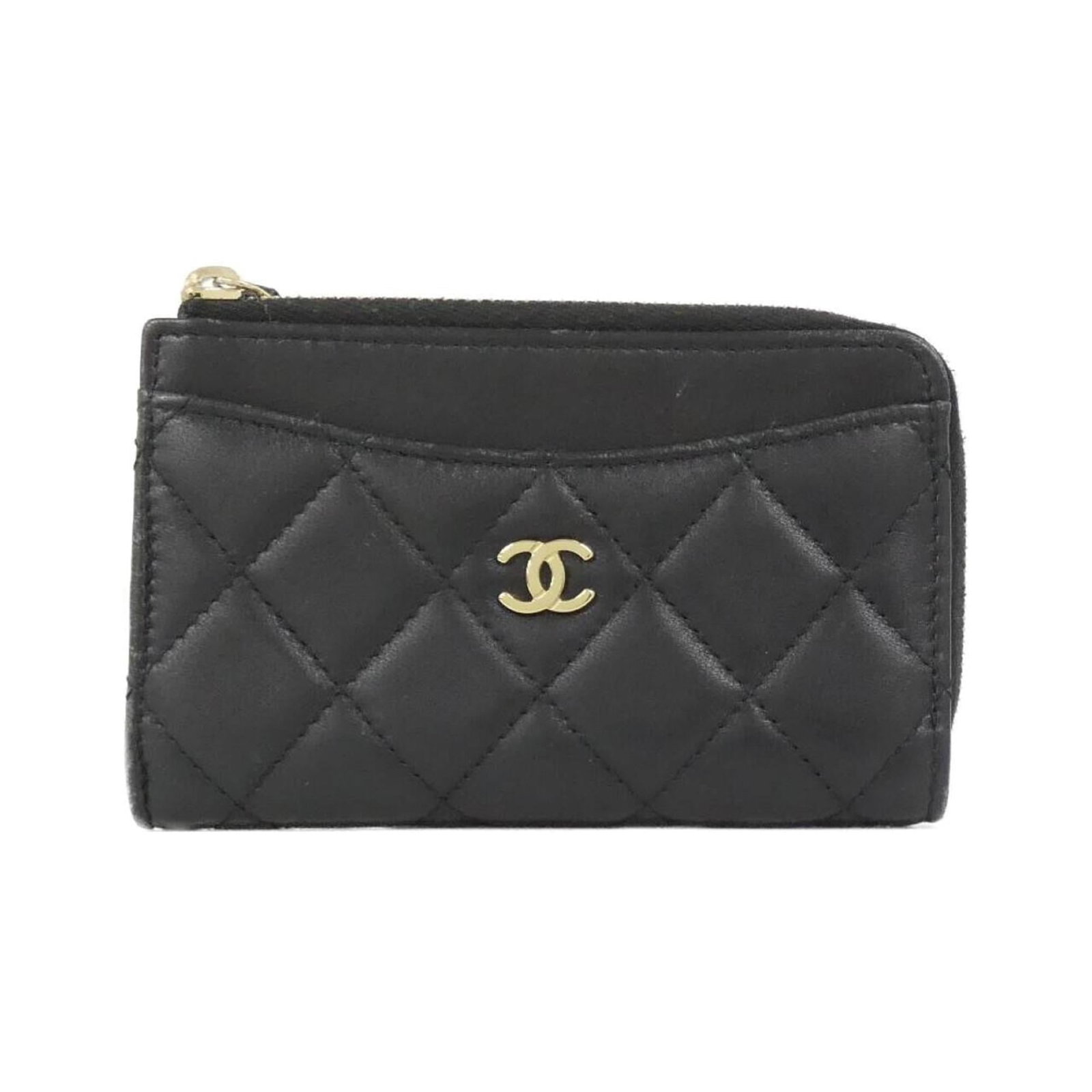 Chanel Leather Card Case: Chanel Leather Card Case A timeless and sophisticated accessory, this Chanel leather card case is crafted from high-quality lamb leather in sleek black. With its classic design and luxurious feel, it'